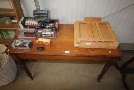 A late Victorian mahogany side table raised on rin