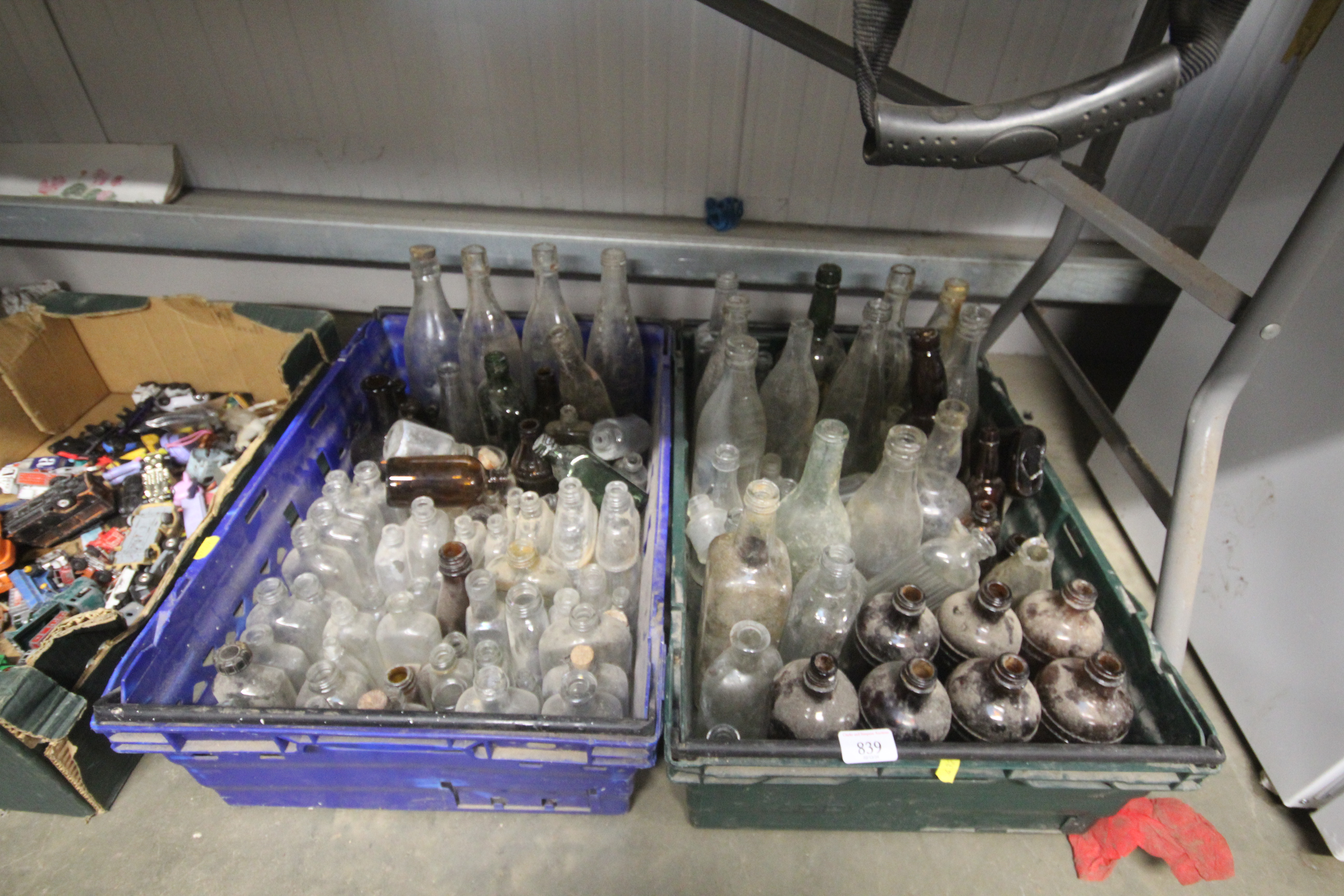Two boxes of vintage glass bottles
