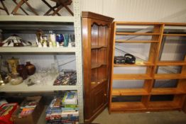 A pine upright corner cupboard