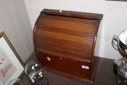 A stationery cabinet with tambour front