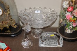 A Nachtmann candlestick decorated with a dolphin,