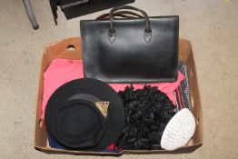 A box containing vintage ladies dresses, hats and