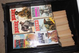 A crate of Western vintage paperback books