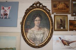 An oval gilt framed portrait study