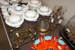 A bevel edged mirror contained in ornate decorated