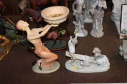 A Nao figure group depicting a girl and boy on a s