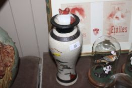 An Oriental crackle glazed vase decorated with fig