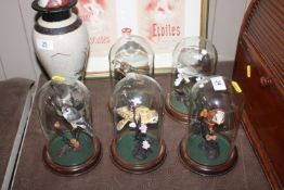 A collection of five bird ornaments contained in g