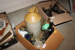 A box containing vintage glass bottles, stoneware