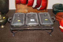 A plated three compartment food warmer with spirit