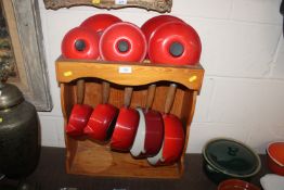 A set of five graduated Le Creuset saucepans and l