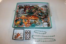 A tray containing various costume jewellery, wrist