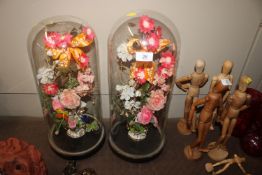 A pair of French glass domes and contents of artif