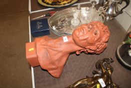 A terracotta pottery bust