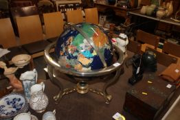 A large mother of pearl and gemstone inset globe o