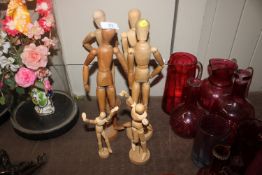 Six artists lay dolls