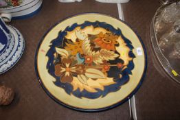 A Longpark of Torquay terracotta charger with flor
