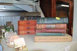 A collection of various books to include The Trium