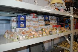 A large collection of Lilliput Lane Cottages and b