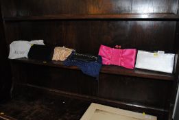 A collection of various designer handbags to inclu