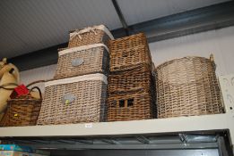 A collection of wicker storage baskets etc.