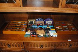 A collection of various die-cast and other model