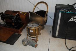 A vintage cycle lamp, brass jardinière and a brass