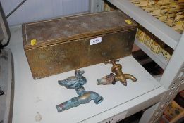 A brass mounted box and two vintage taps