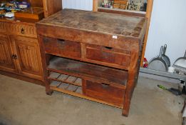 A rustic style butchers block with drawers and she