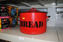 An enamel bread crock