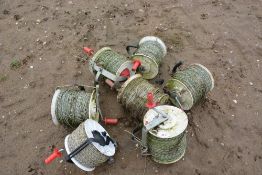Rolls of electric fence wire as lotted