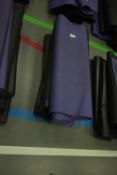 Four Black and One Purple Yoga Mats