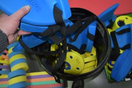 ~24 Zoggs Yellow Armband Float Discs and Four Shark Fin Floats