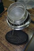 Quantity of Stainless Steel Colanders, Bowls, and Four Cast Iron Sizzler Dishes
