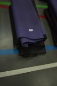 Four Black and One Purple Yoga Mats