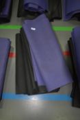 Four Black and One Purple Yoga Mats