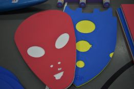 Red Alien Head Float and a Blue Spaceship Float