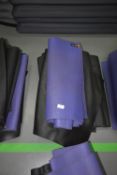 Four Black and One Purple Yoga Mats
