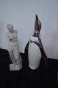 Penguin and a Figurine