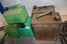 Three Plastic and Two Metal Oil Cans