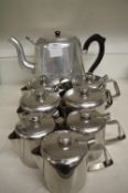 Seven Small and One Large Stainless Steel Teapots