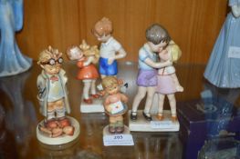 Four Hummel and Goebel Figurines