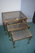 Nest of Three Brass Table with Smoked Glass Tops