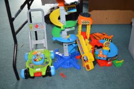 *VTech Push Along Mower, plus a Construction Site