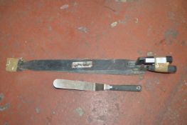 *Two Slate Rippers, and a Spatula