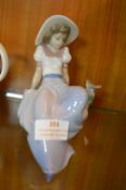 Nao Figurine of a Seated Girl and a Bird