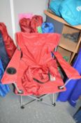 Five Red and One Blue Folding Camping Chairs