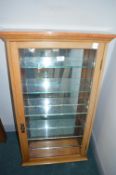 Light Oak Mirror Backed Collectors Cabinet
