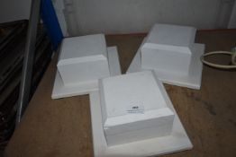 Three White Pedestals