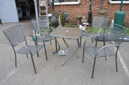 *Four Stacking Garden Chairs plus a Table